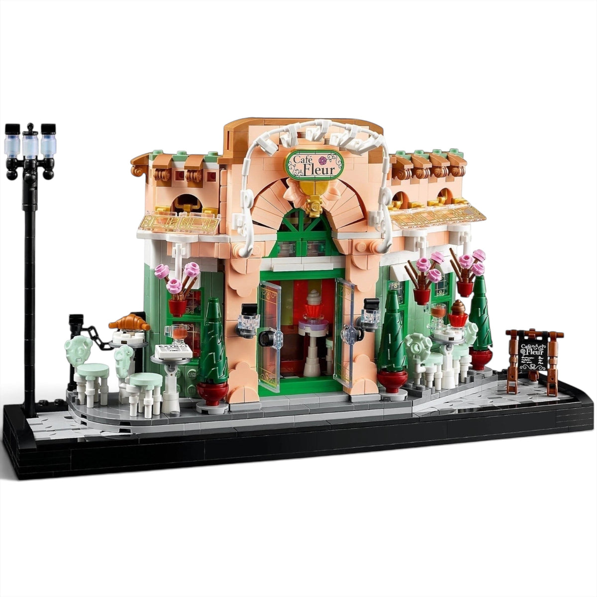 [built-angle] A Brick Apart LEGO Icons French Café building set featuring a detailed bistro facade, outdoor seating, and streetlamp.