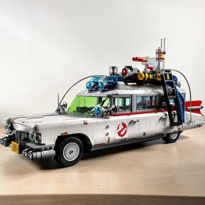 [lifestyle-shelf-built] A Brick Apart LEGO Ghostbusters ECTO-1 model car featuring authentic 1959 Cadillac details and ghost-hunting gear.