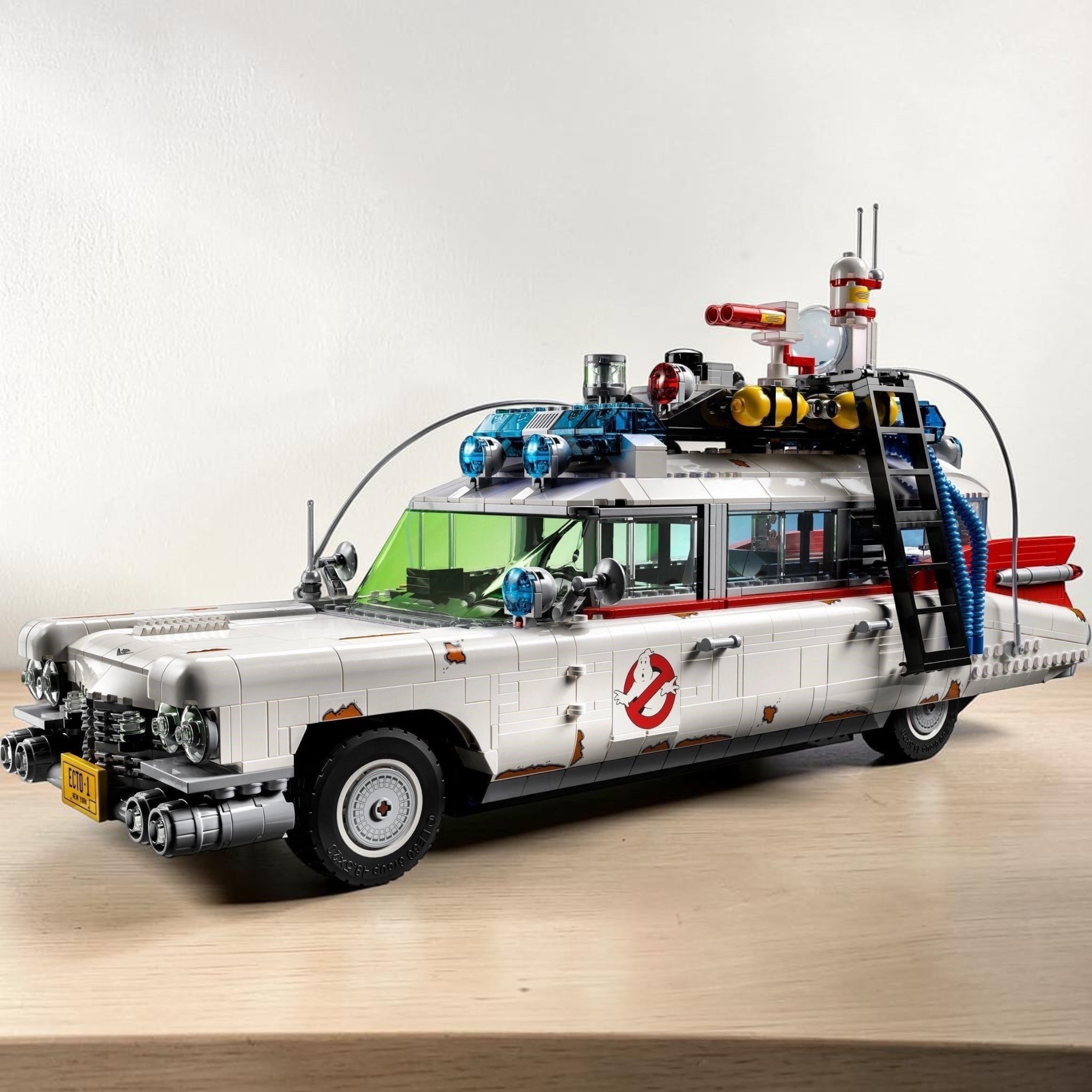 A Brick Apart LEGO Ghostbusters ECTO-1 model car featuring authentic 1959 Cadillac details and ghost-hunting gear.