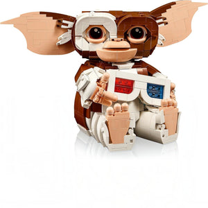 A Brick Apart LEGO Ideas Gremlins Gizmo posable figure holding brick-built 3D glasses with large ears and brown fur.