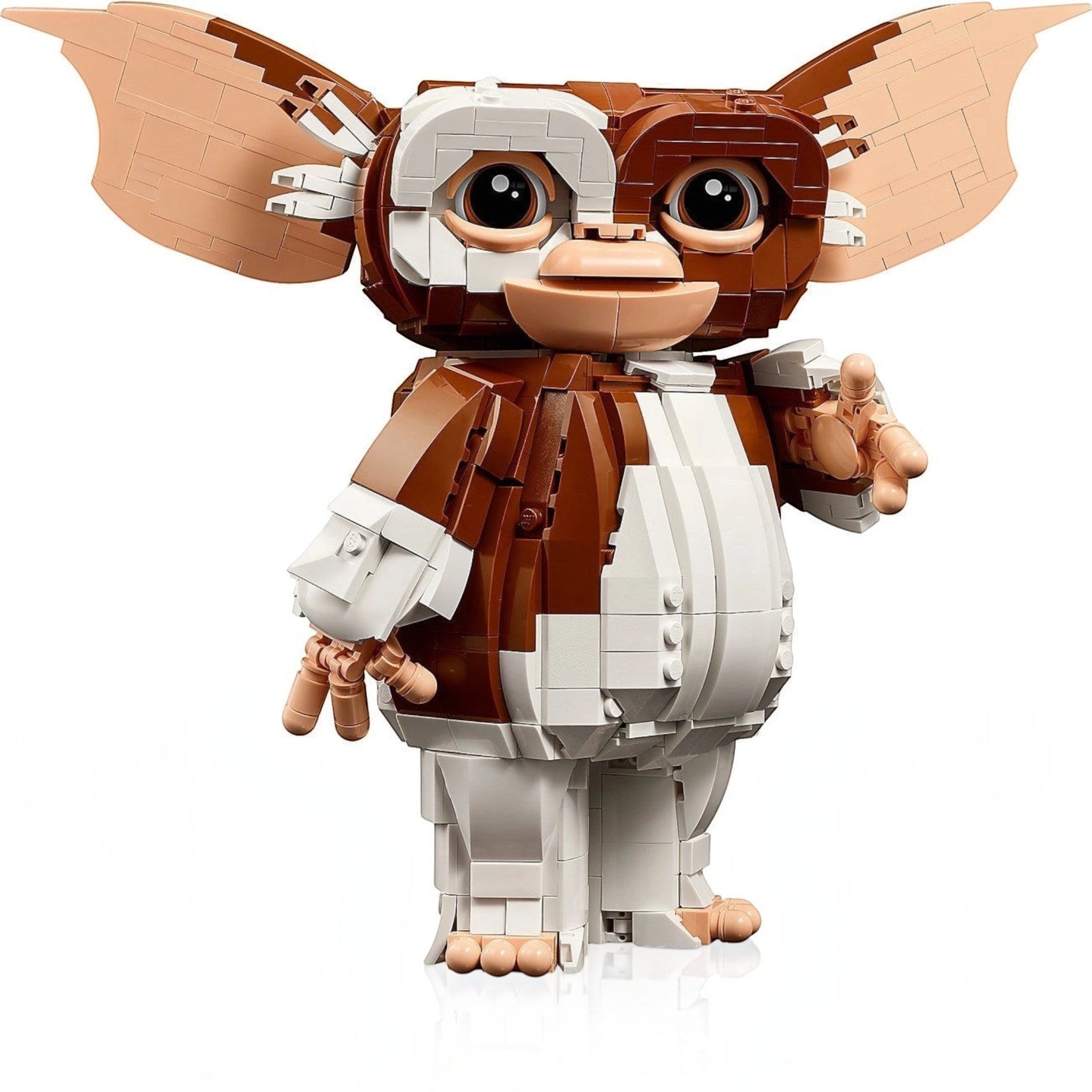 A Brick Apart LEGO Ideas Gizmo figure from Gremlins with posable ears, arms, and head on a white background.