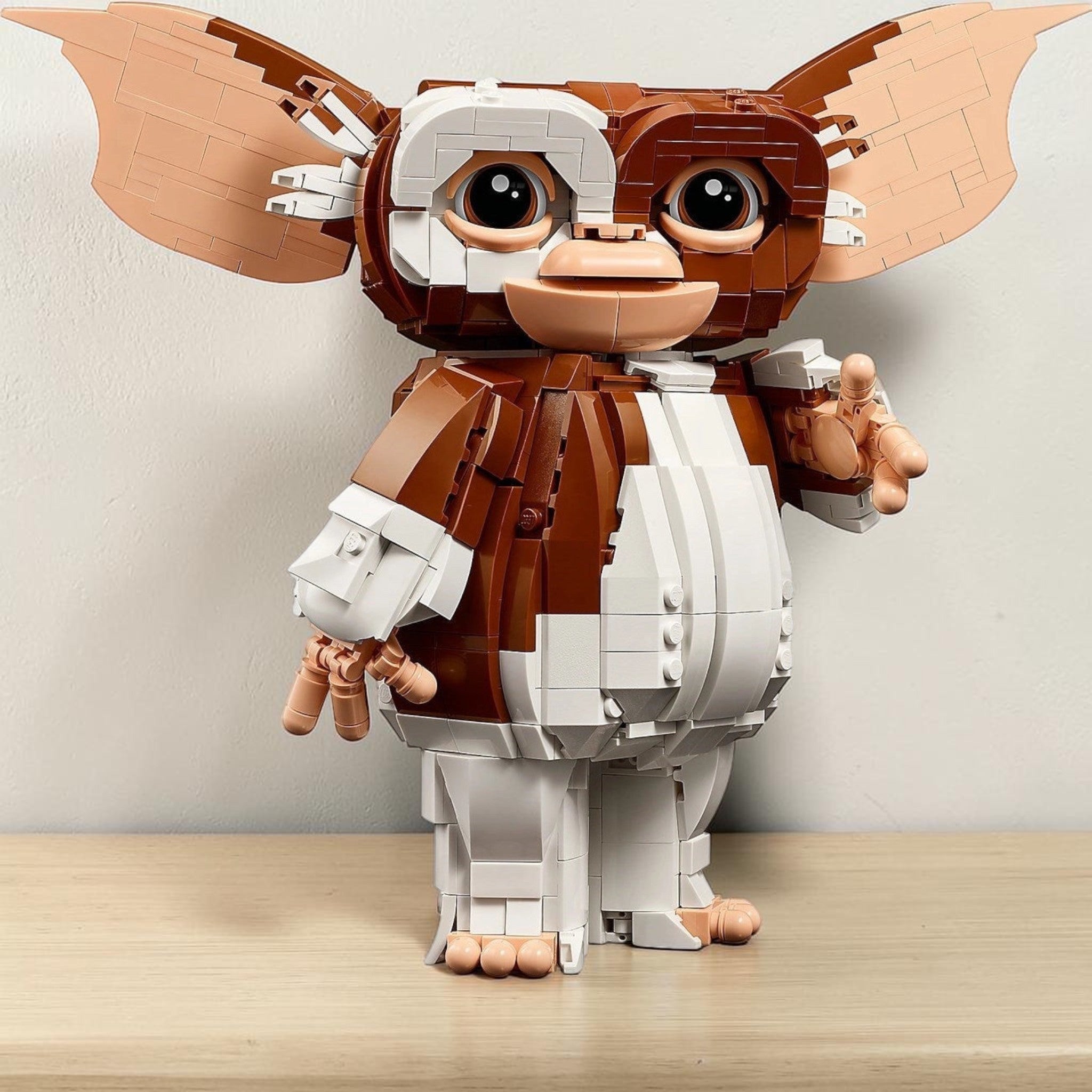 A Brick Apart LEGO Ideas Gremlins Gizmo posable figure with large ears and brown and white brick-built details.