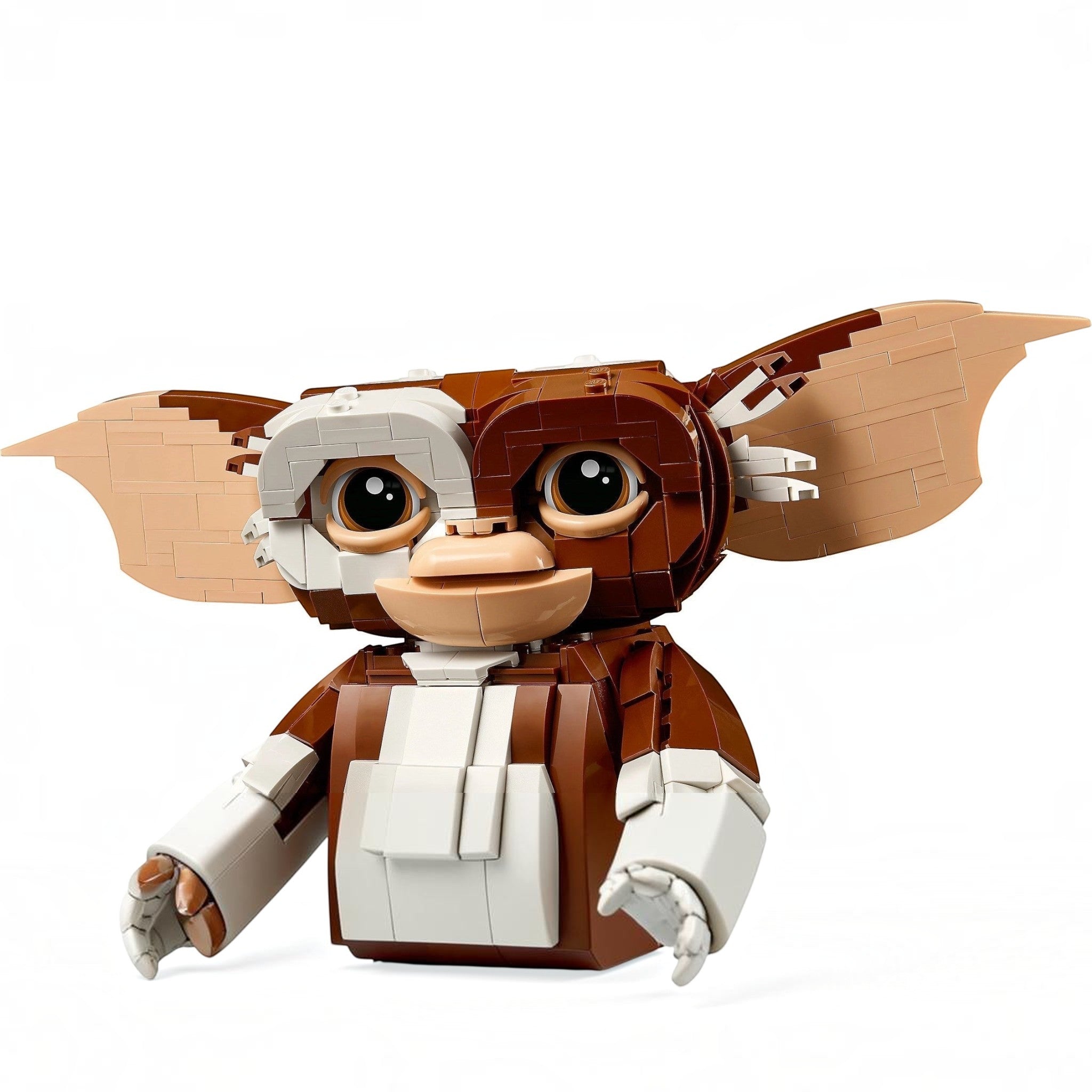 A Brick Apart LEGO Ideas Gizmo figure from Gremlins with large ears, brown and white fur details, and posable limbs.