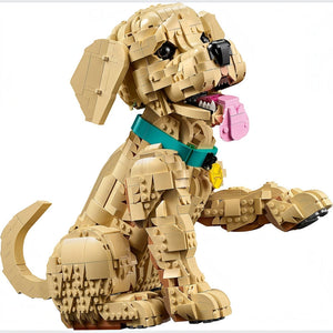 A Brick Apart LEGO Icons Golden Retriever puppy model with a teal collar, pink tongue, and posable limbs on white.