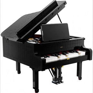 [built-white] A Brick Apart LEGO Ideas Grand Piano set with a black brick-built body, open lid, and smartphone mounted on the keys.