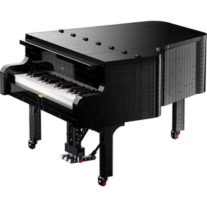 A Brick Apart LEGO Ideas Grand Piano model in black with a realistic keyboard, pedal, and detailed brick construction.