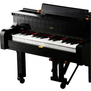 [built-detail] A Brick Apart LEGO Ideas Grand Piano model with black casing, white keys, and authentic moving hammer action mechanism.