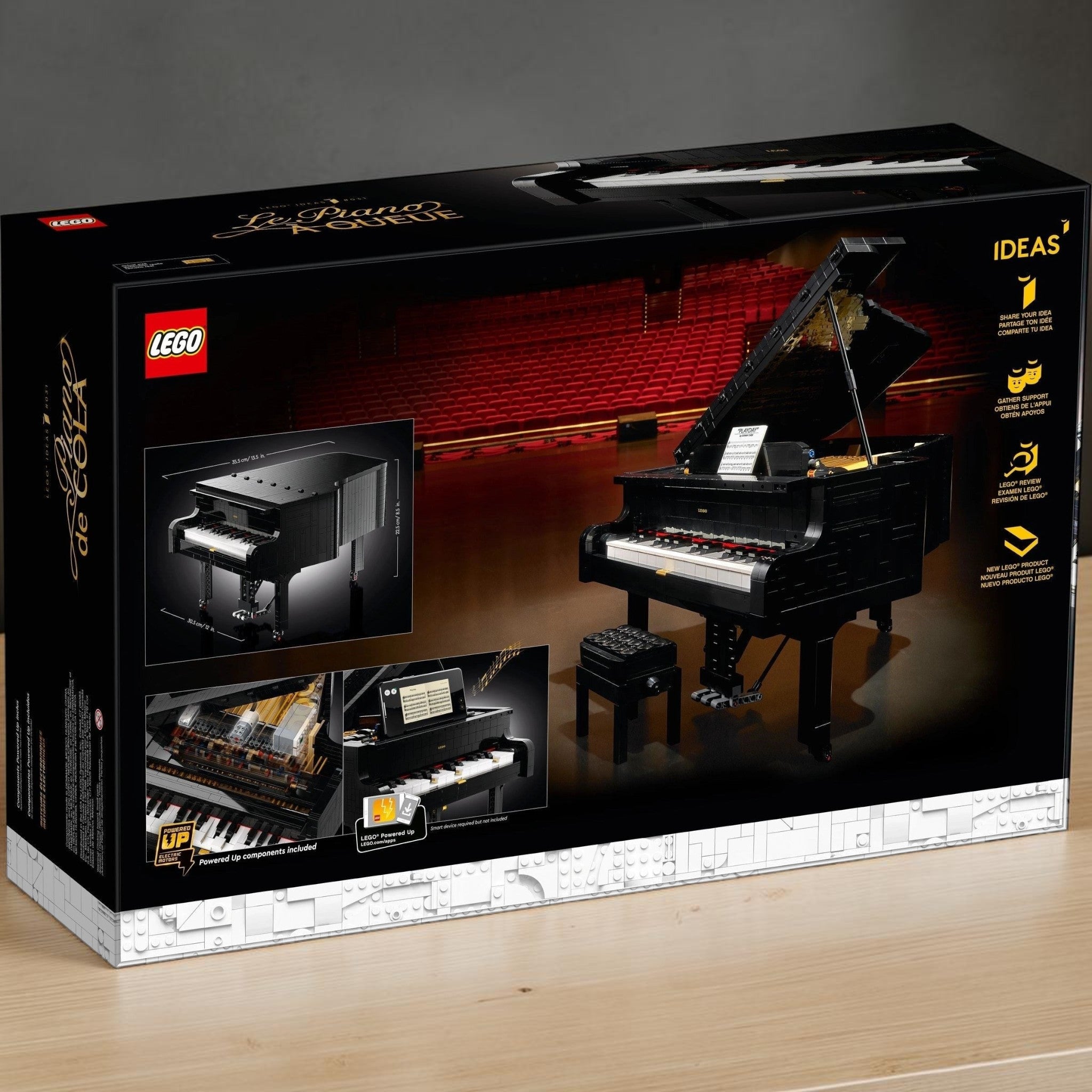 A Brick Apart LEGO Ideas Grand Piano set box showing the playable black brick-built concert piano and adjustable bench.