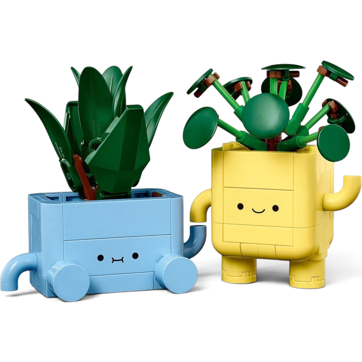 [built-angle] A Brick Apart LEGO Botanicals Happy Plants set featuring a baby dracaena and pilea in cute blue and yellow pots.