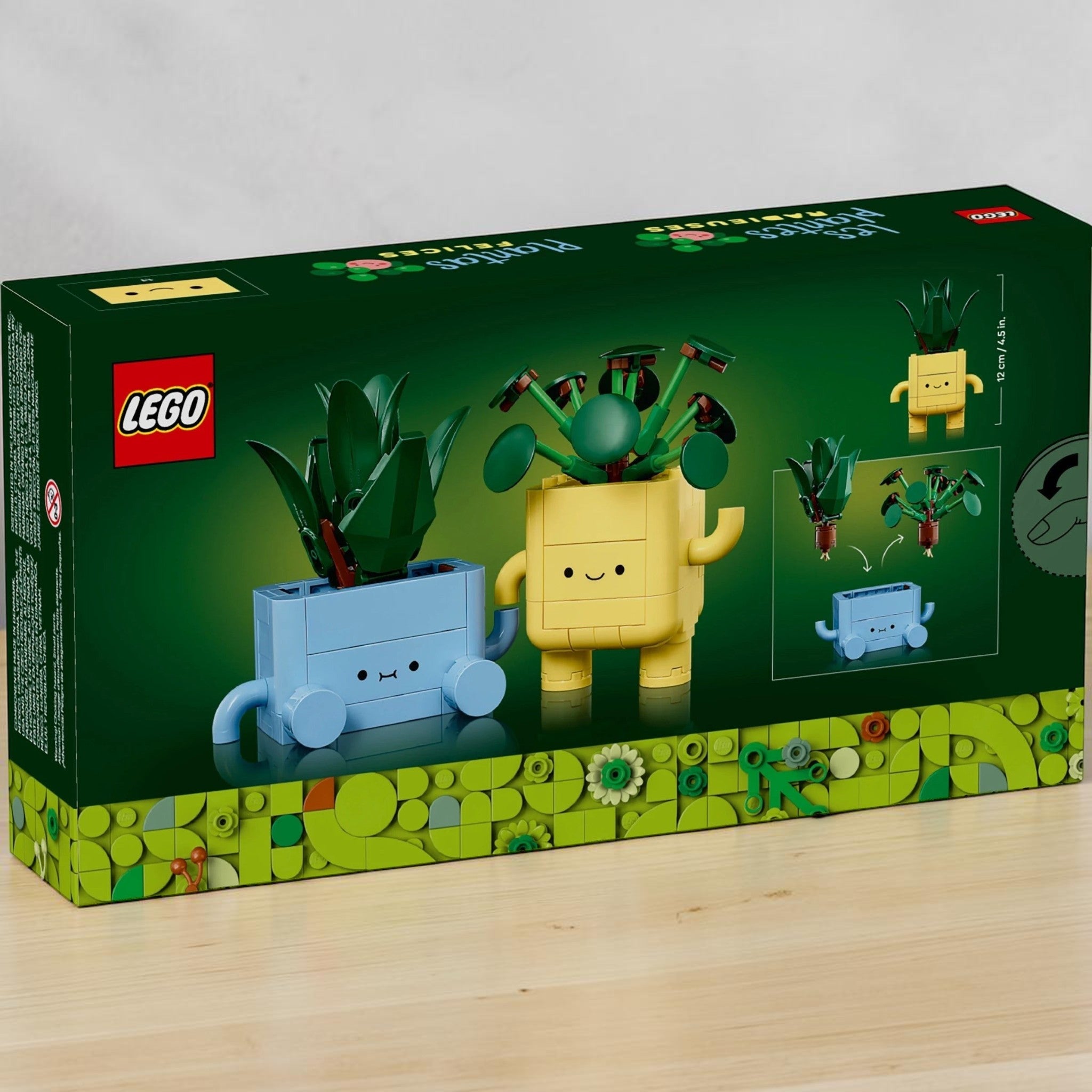 A Brick Apart LEGO Botanicals Happy Plants set box featuring a buildable baby dracaena and pilea in cute face pots.