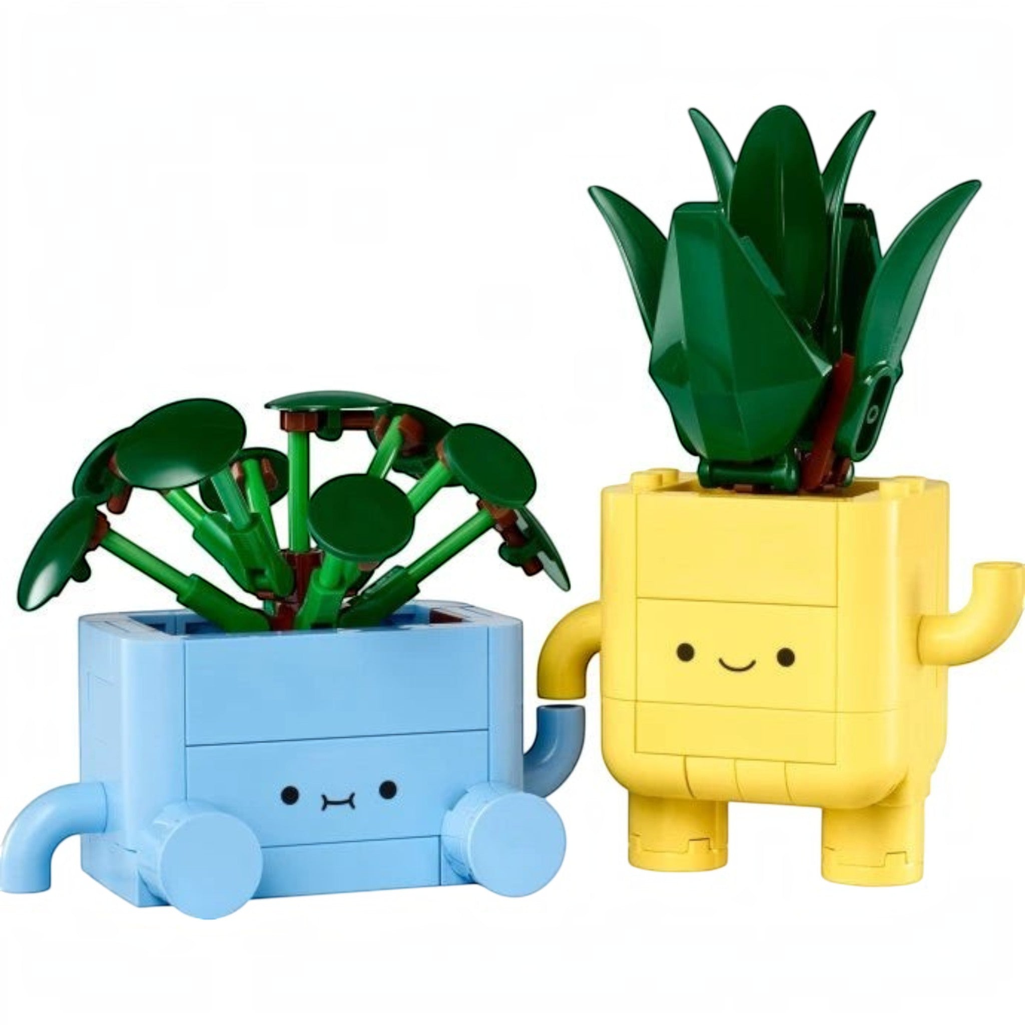 A Brick Apart LEGO Botanicals Happy Plants set featuring a green pilea in a blue pot and a dracaena in a yellow pot.