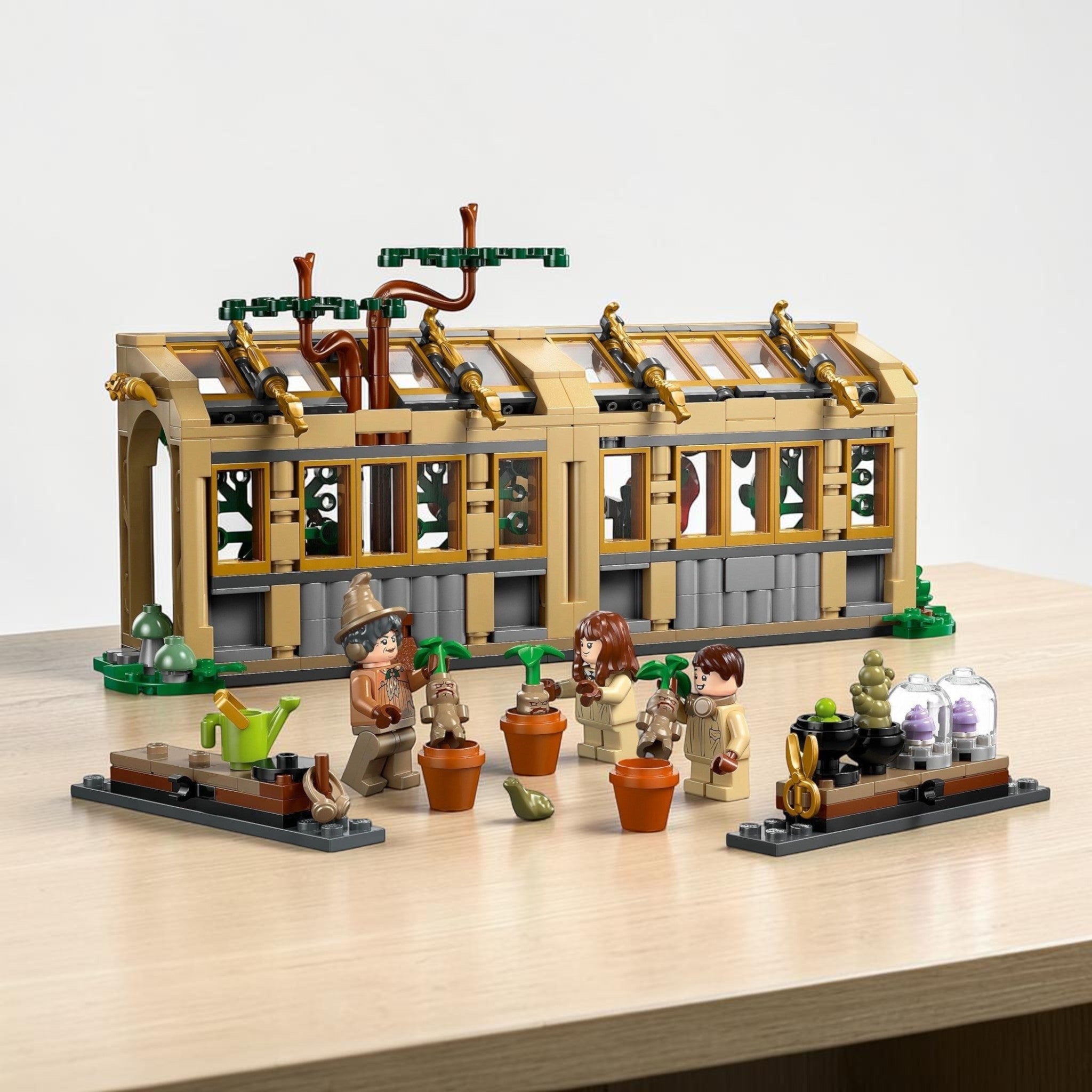A Brick Apart LEGO Harry Potter Herbology Class set featuring a greenhouse, minifigures, and Mandrake plant toys.