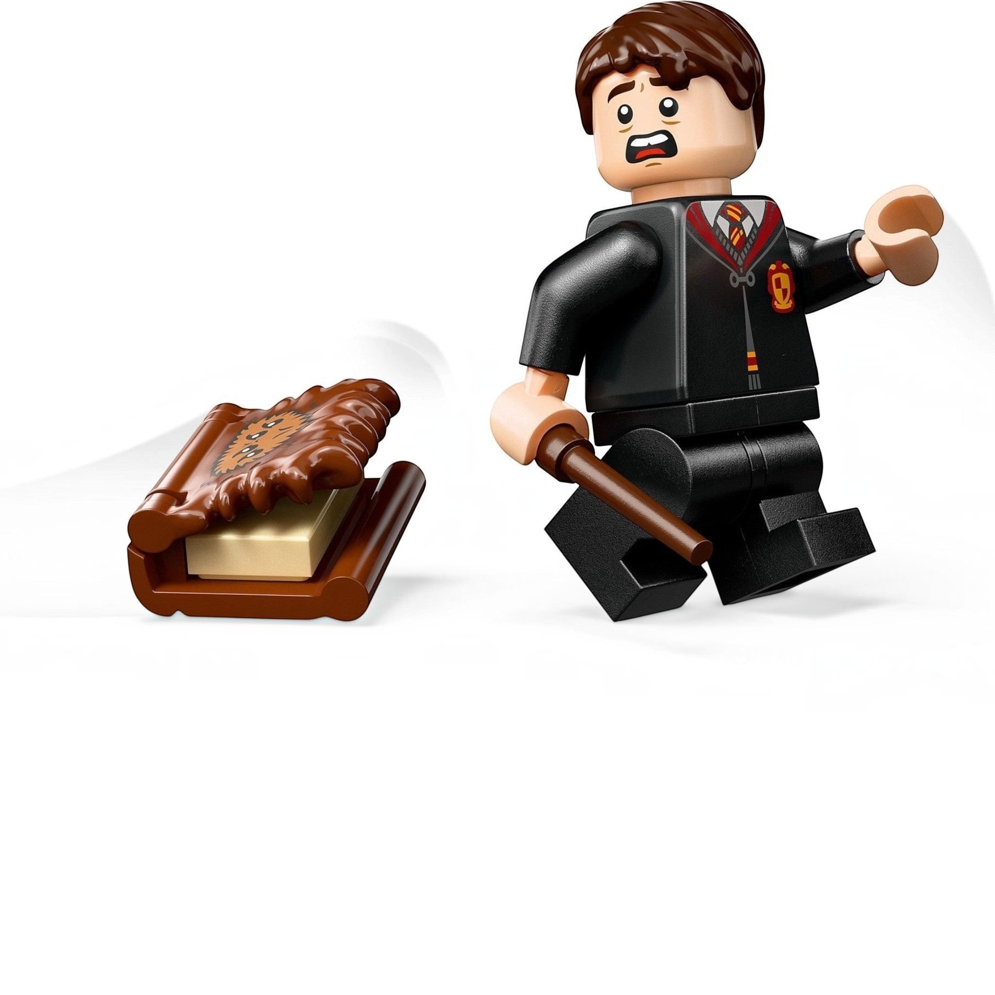 A Brick Apart LEGO Harry Potter Monster Book of Monsters set with a running Neville Longbottom minifigure