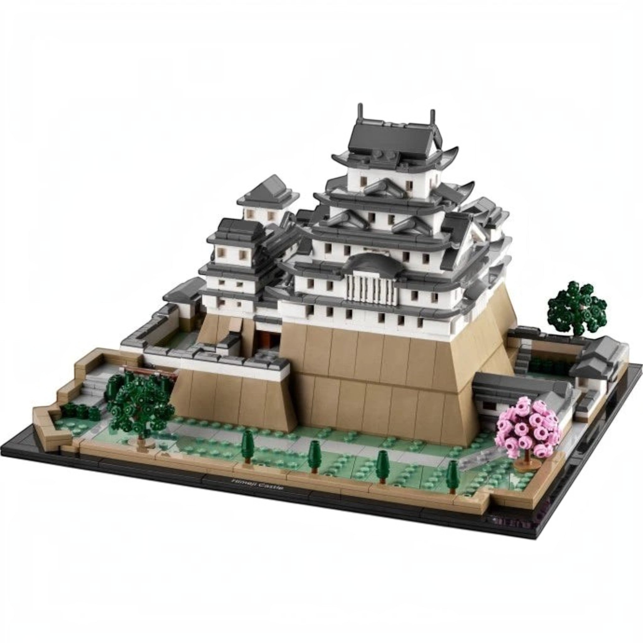 A Brick Apart LEGO Architecture Himeji Castle model featuring white and grey walls with pink cherry blossom trees.