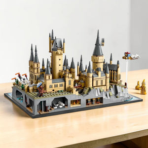 [lifestyle-shelf-built] A Brick Apart LEGO Harry Potter Hogwarts Castle and Grounds display model featuring intricate towers and interior rooms.