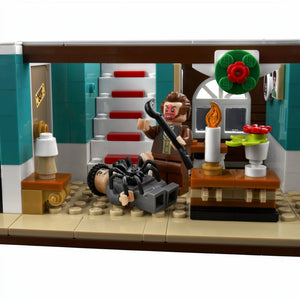 A Brick Apart LEGO Home Alone set featuring Marv minifigure with a crowbar and spider in the McCallisters house interior