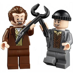 A Brick Apart LEGO Home Alone minifigures of Harry and Marv holding black crowbars from the 21330 set