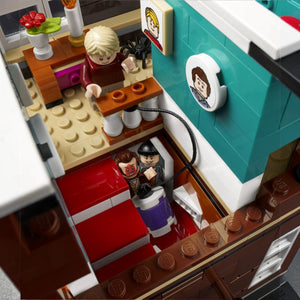 A Brick Apart LEGO Home Alone set featuring Kevin McCallister minifigure and burglars Harry and Marv in the house