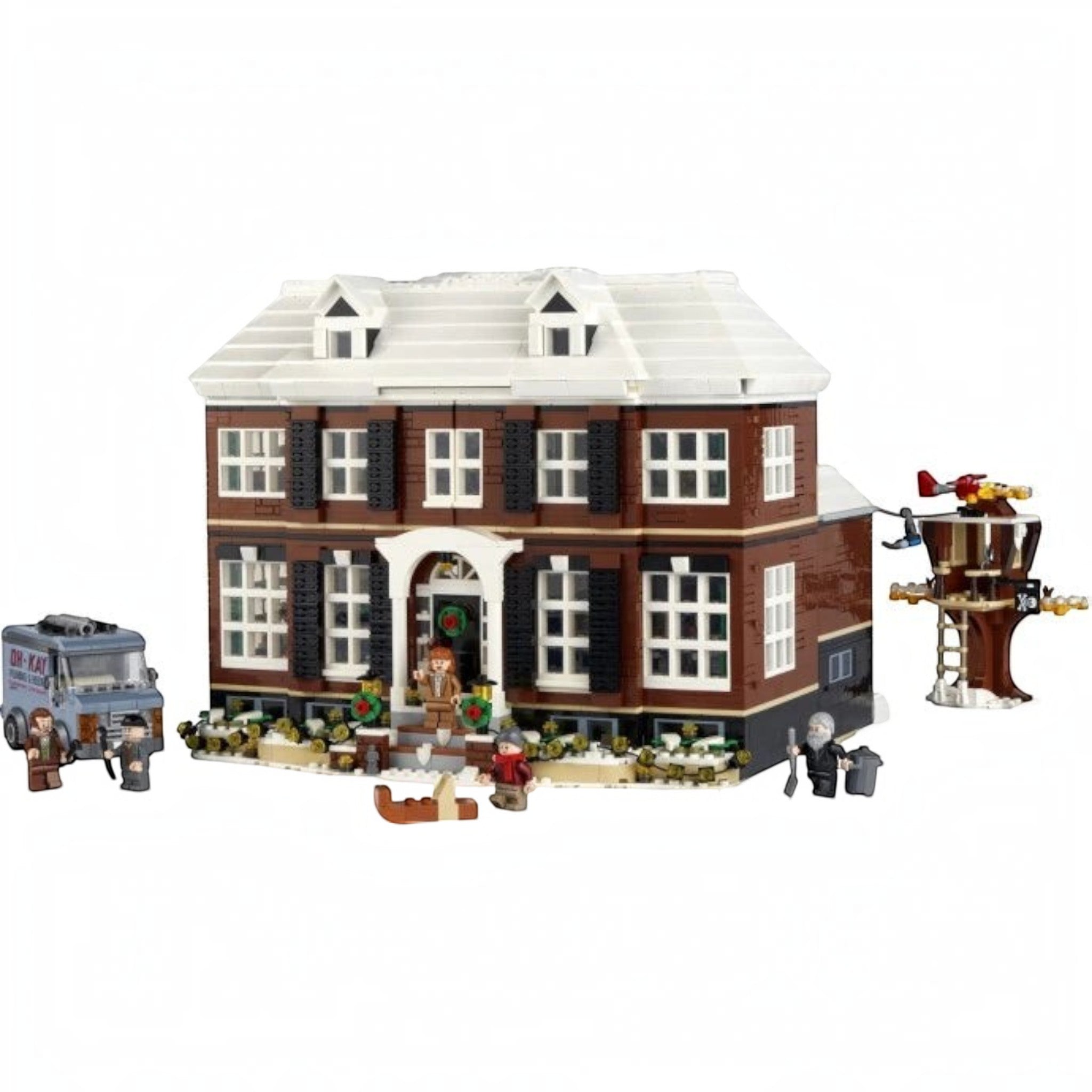 A Brick Apart LEGO Ideas Home Alone set featuring the McCallisters house, minifigures, and a van on a white background.