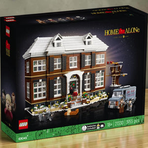 A Brick Apart LEGO Ideas Home Alone set featuring the McCallisters house, minifigures, and the Oh-Kay plumbing van.