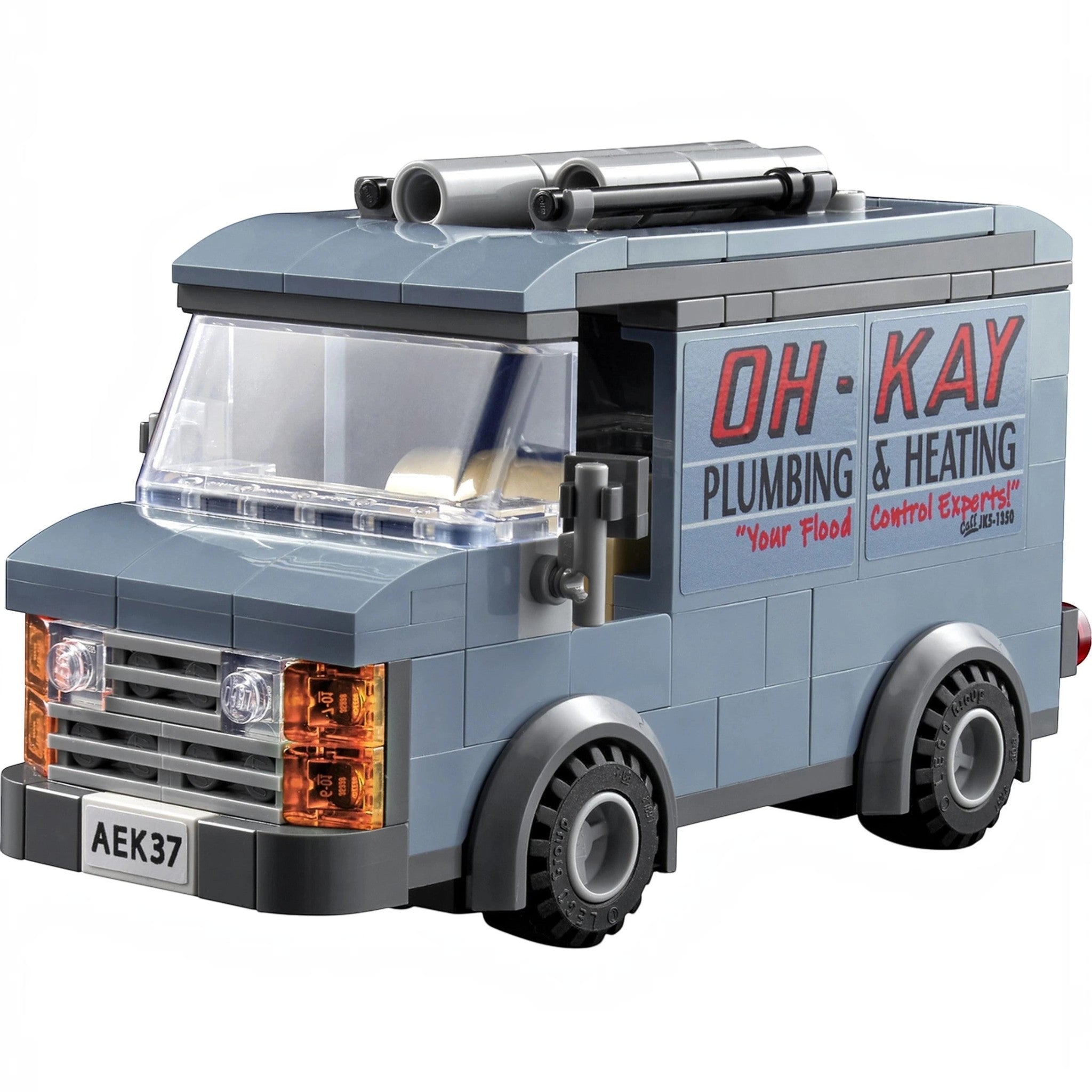 A Brick Apart LEGO Home Alone Oh-Kay Plumbing and Heating van with grey bricks and printed side logo