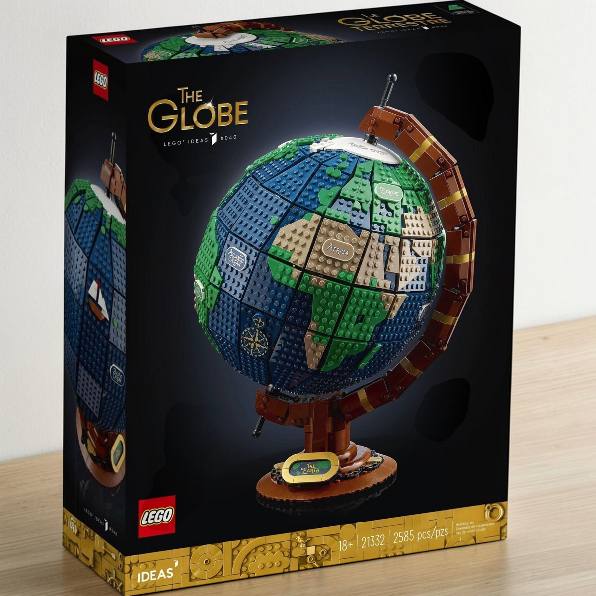 [lifestyle-shelf-box] A Brick Apart LEGO Ideas The Globe set box featuring a detailed buildable vintage earth model with spinning axis.