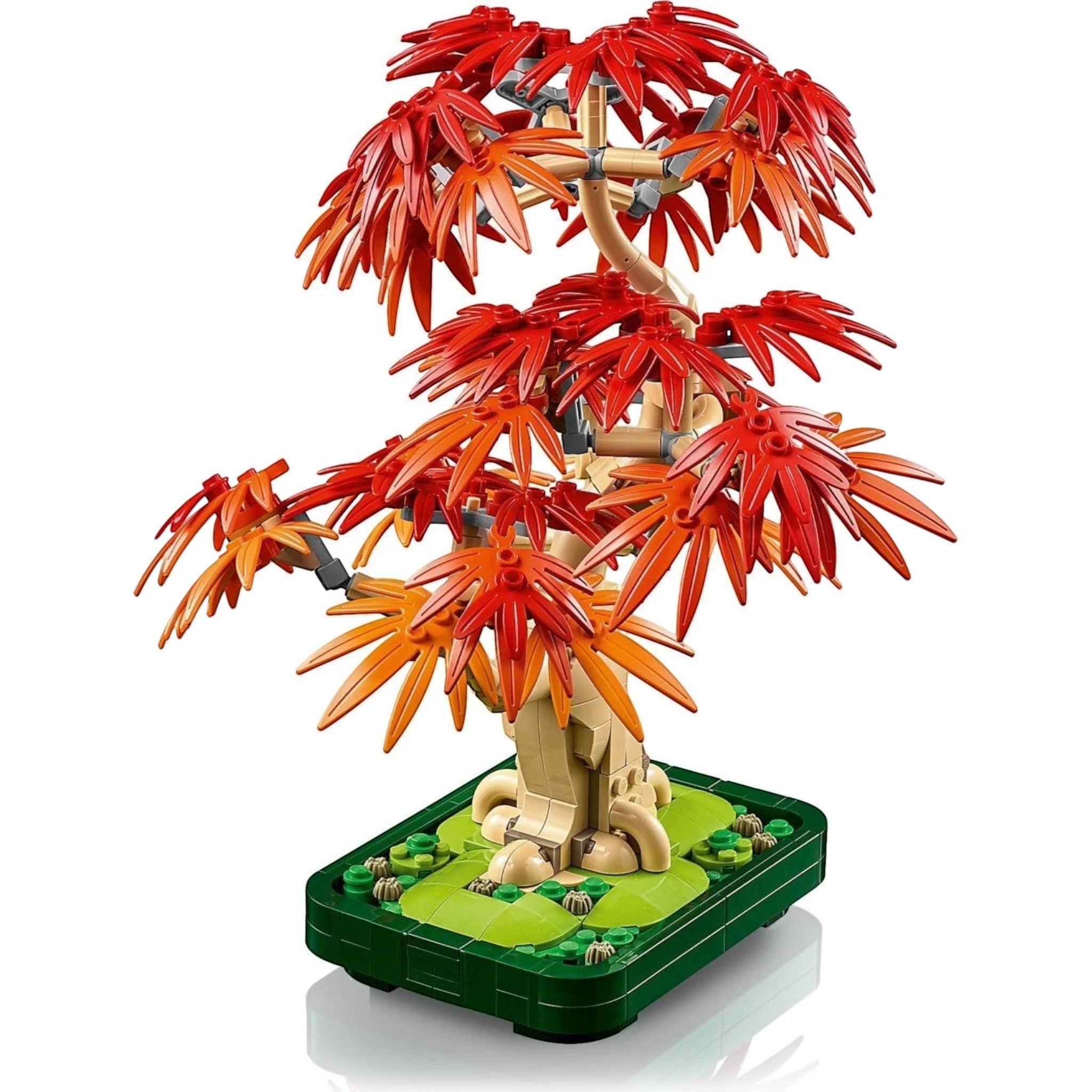 A Brick Apart LEGO Botanicals Japanese Maple Tree with vibrant red and orange leaves in a dark green bonsai pot.