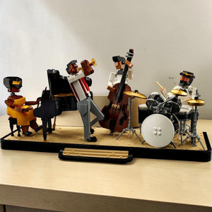 [lifestyle-shelf-built] A Brick Apart LEGO Ideas Jazz Quartet set featuring a pianist, trumpeter, bassist, and drummer on a stage display.
