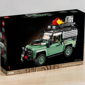 A Brick Apart LEGO Icons Land Rover Classic Defender 90 set box featuring a sand green off-road vehicle model.