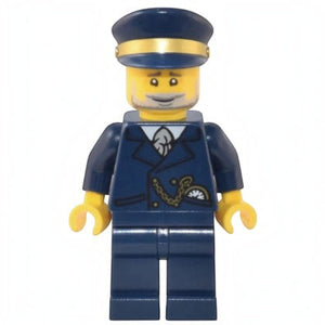 A Brick Apart LEGO lighthouse keeper minifigure wearing a dark blue uniform with a gold chain and matching cap.