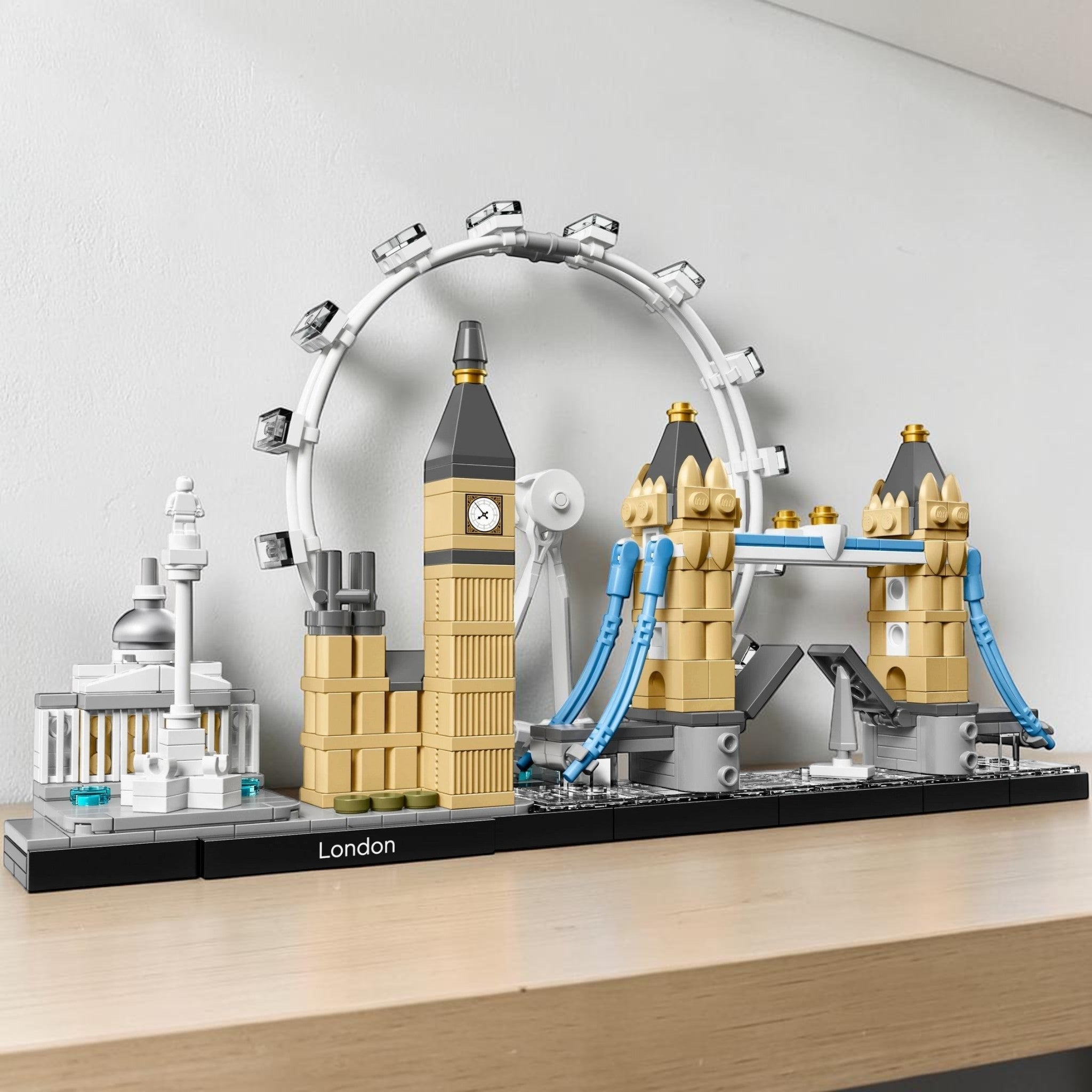 A Brick Apart LEGO Architecture London skyline set featuring Big Ben, London Eye, and Tower Bridge on a display base.