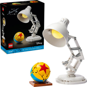 A Brick Apart LEGO Ideas Disney Pixar Luxo Jr. buildable lamp model with an articulated arm and iconic yellow ball.