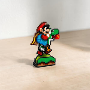 A Brick Apart LEGO Super Mario World pixelated Mario and Yoshi display model with interactive running features.