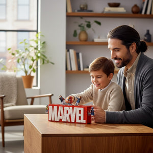A Brick Apart LEGO Marvel logo set with Avengers minifigures being played with by a father and son in a living room.