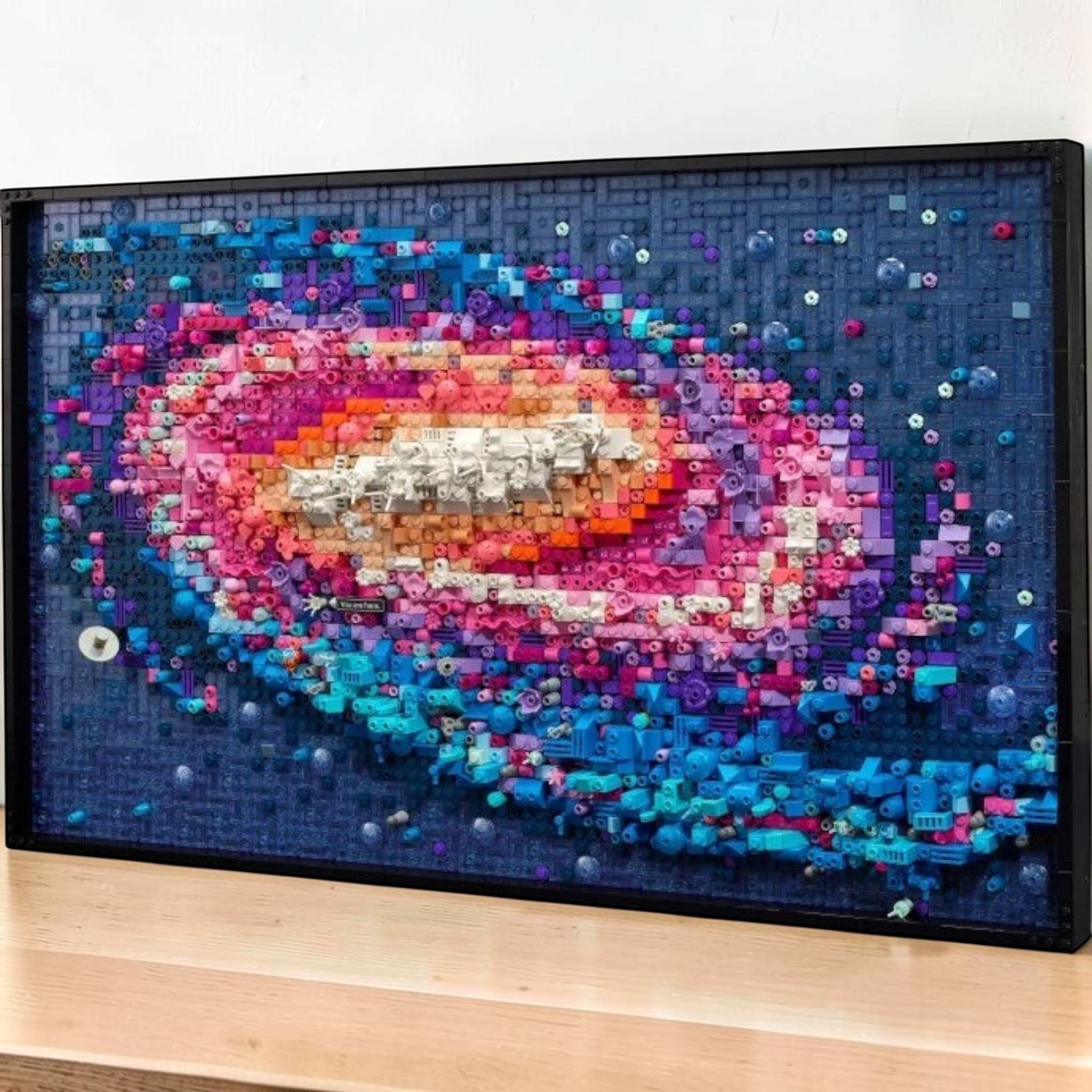 A Brick Apart LEGO Art The Milky Way Galaxy wall art set featuring a 3D textured spiral design in vibrant cosmic colors.