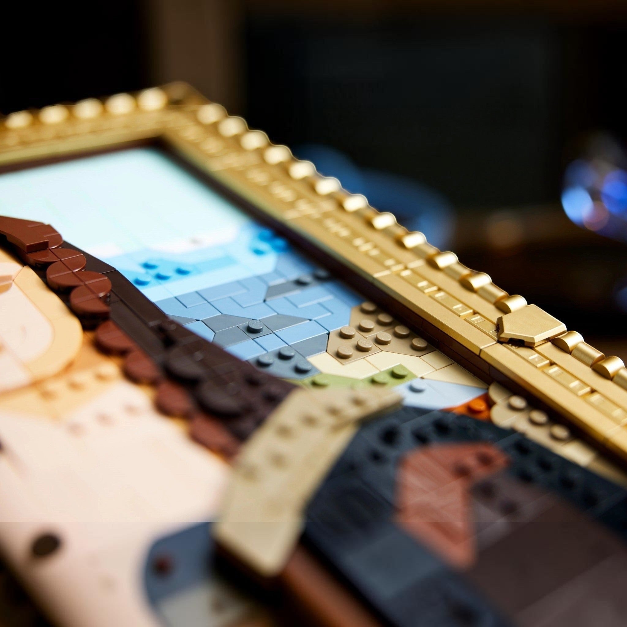 A Brick Apart LEGO Art Mona Lisa set featuring a detailed brick-built painting in an elegant gold-colored frame.