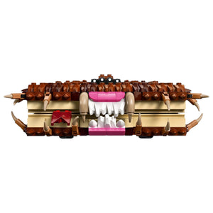 [built-detail] A Brick Apart LEGO Harry Potter Monster Book of Monsters with brown textured cover, sharp fangs, and pink tongue.