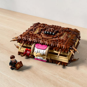 A Brick Apart LEGO Harry Potter Monster Book of Monsters set with a Neville Longbottom minifigure and display box.
