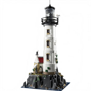 A Brick Apart LEGO Ideas Motorised Lighthouse set featuring a tall white tower with a rotating light on rocky base