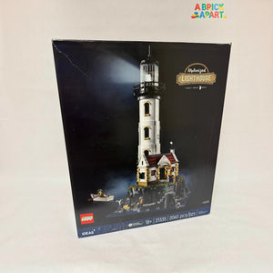 A Brick Apart LEGO Ideas Motorised Lighthouse set box showing the tall tower, cottage, and rowing boat on rocks.