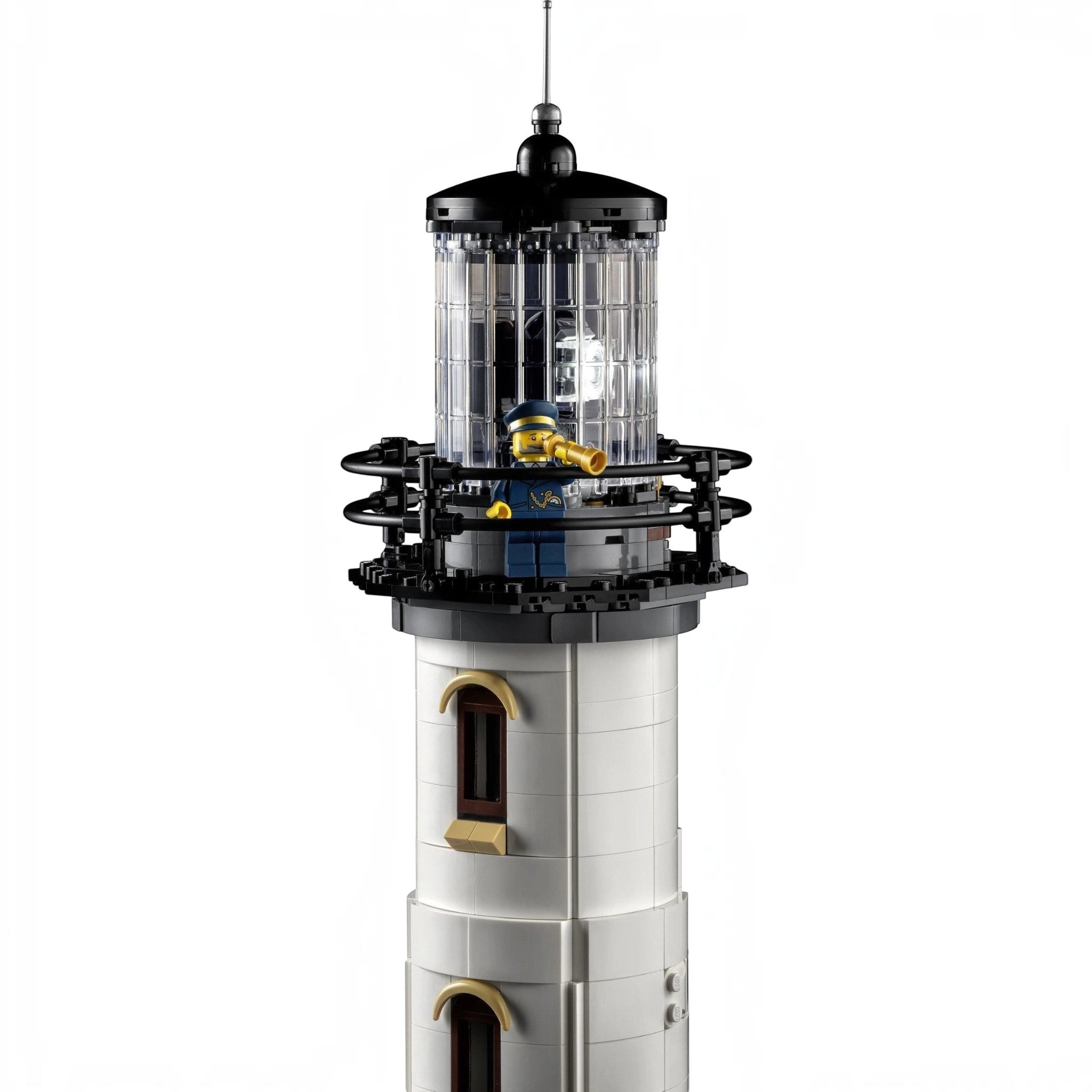 A Brick Apart LEGO Ideas Motorised Lighthouse tower with a rotating light, Fresnel lens, and a lighthouse keeper.