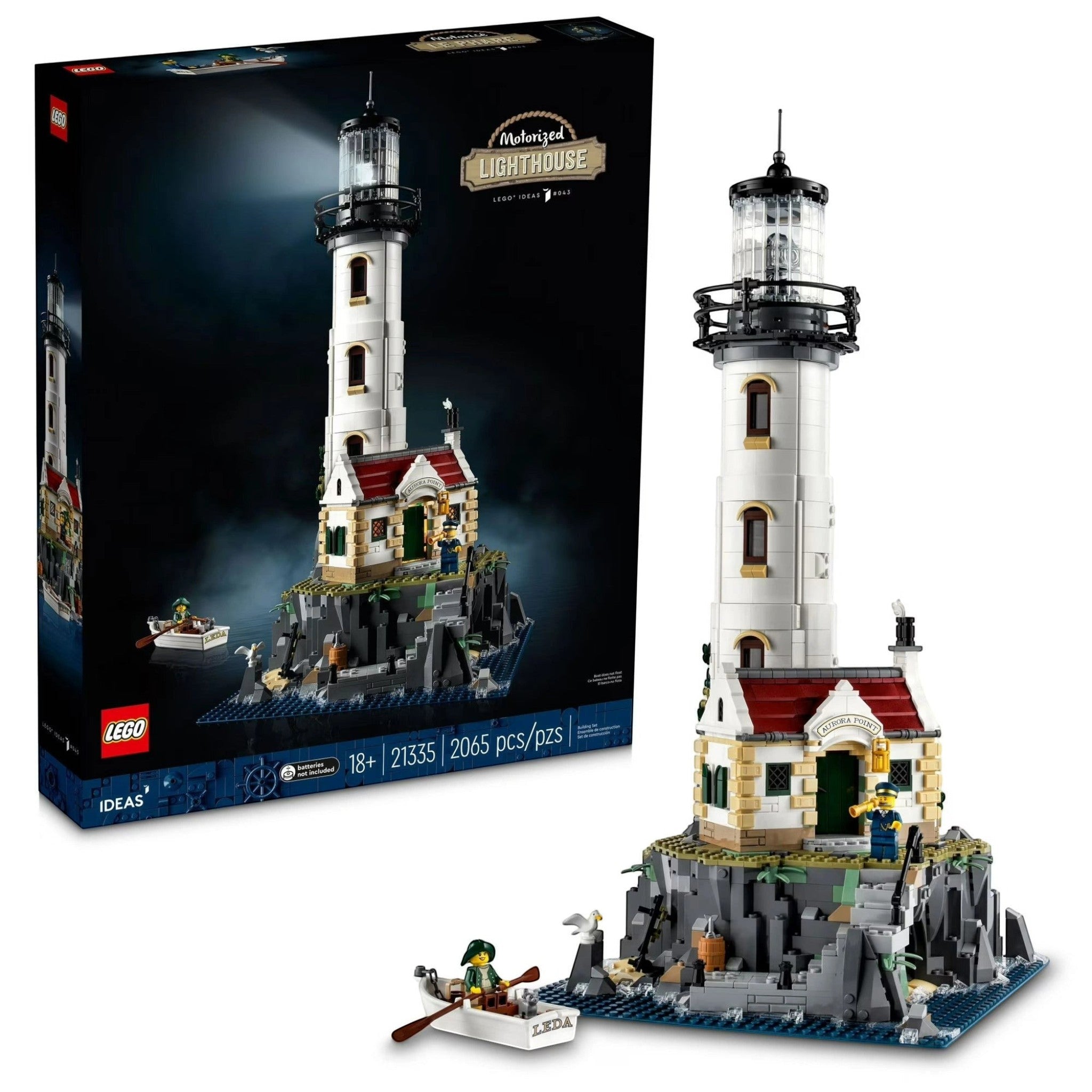 A Brick Apart LEGO Ideas Motorised Lighthouse set featuring a detailed tower, cottage, rocky base, and minifigures.