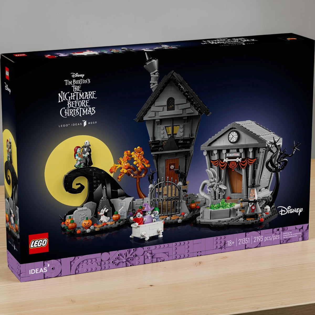 [lifestyle-shelf-box] A Brick Apart LEGO Ideas Nightmare Before Christmas set featuring Spiral Hill, Jack's house, and Town Hall diorama.