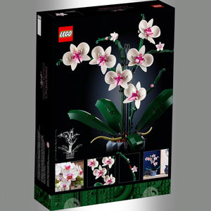 A Brick Apart LEGO Icons Orchid set box featuring a white and pink floral model in a blue fluted vase.