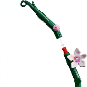 A Brick Apart LEGO Icons Orchid building set showing a green stem being connected to a white and pink flower piece.