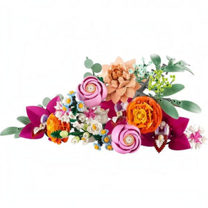 A Brick Apart LEGO Botanicals Pretty Pink Flower Bouquet featuring diverse colorful plastic flowers and green stems.