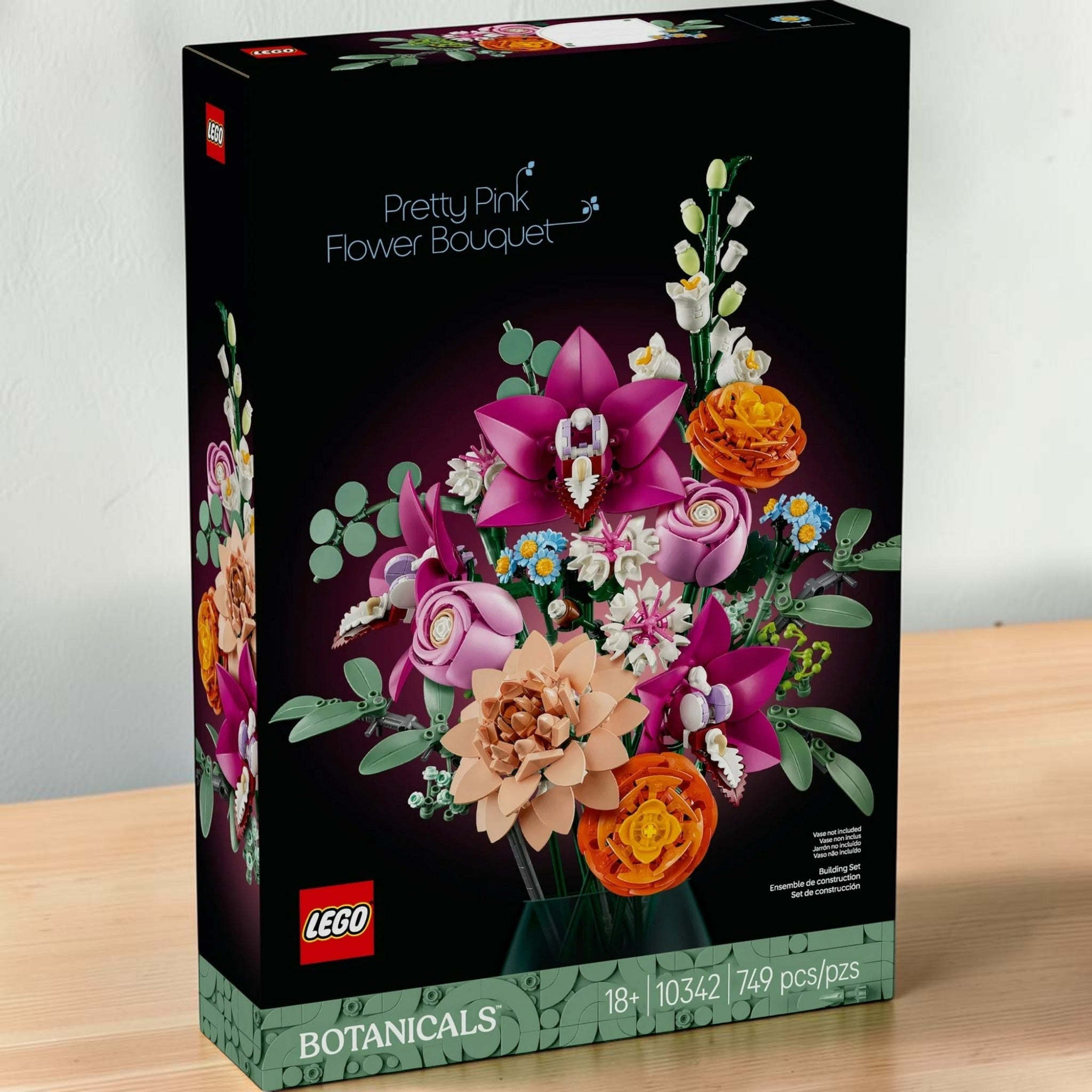 A Brick Apart LEGO Botanicals Pretty Pink Flower Bouquet building set box featuring various colorful plastic flowers.