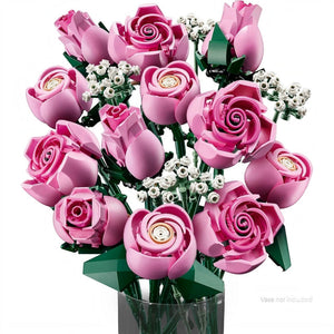 A Brick Apart LEGO Botanicals bouquet of 12 pink roses in various bloom stages with white baby's-breath sprigs.