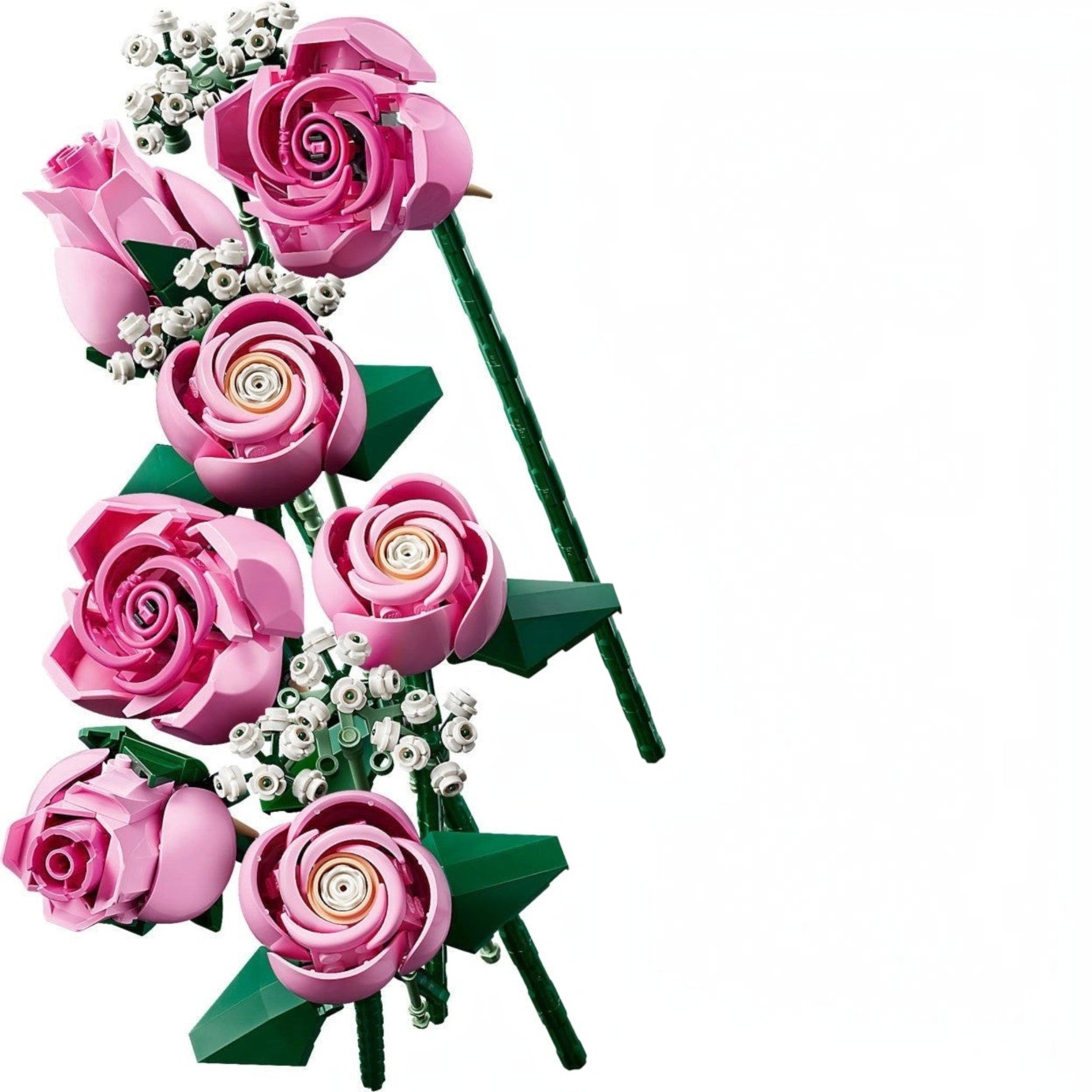 A Brick Apart LEGO Botanicals bouquet featuring pink roses in various bloom stages with white baby's-breath sprigs.