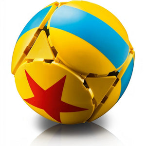 A Brick Apart LEGO Disney Pixar ball with yellow panels, blue stripes, and a red star, inspired by Luxo Jr.